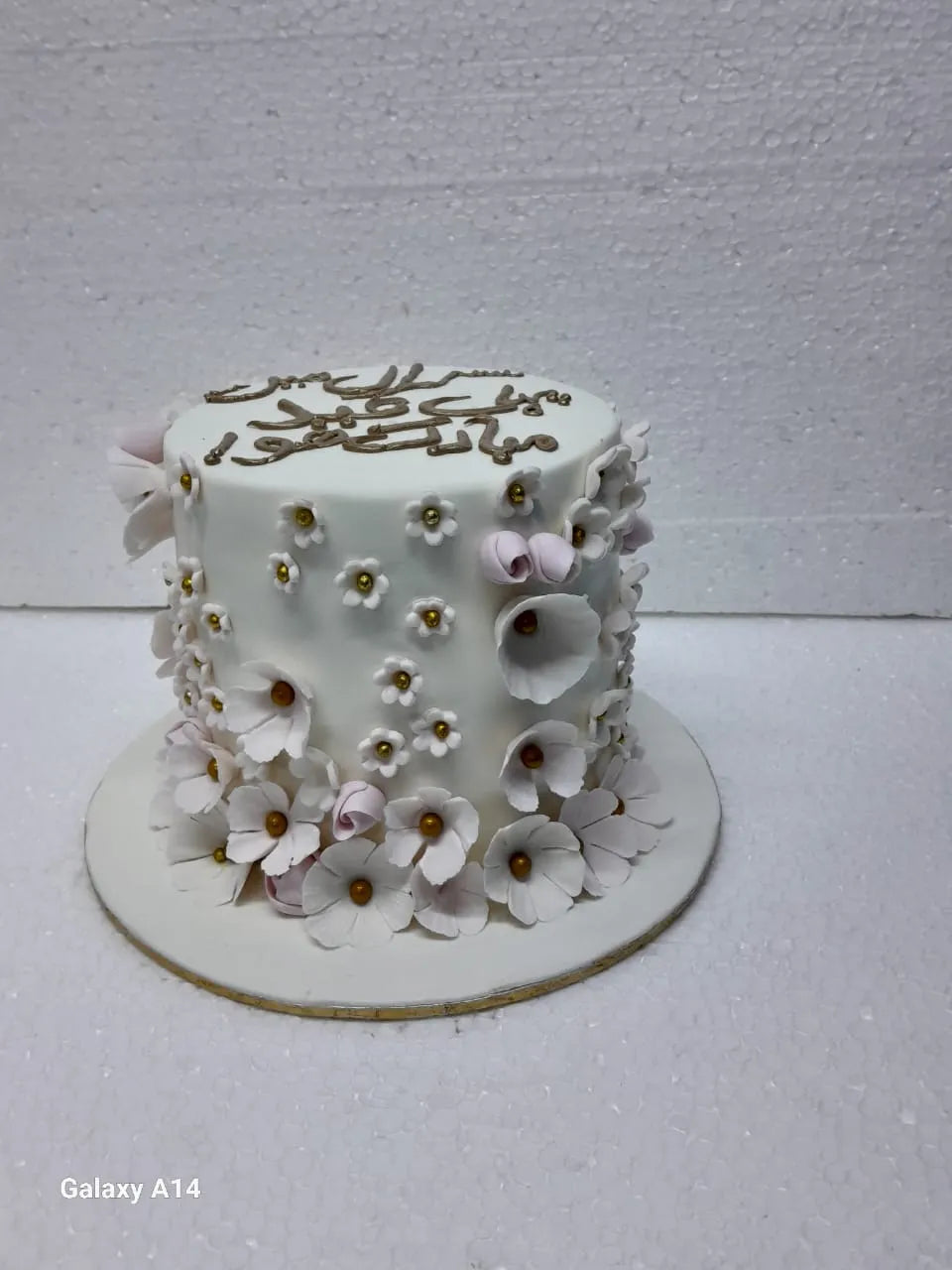 Decorative cake with floral designs on a white background