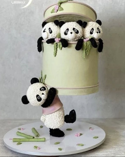 Decorative cake with panda design on a neutral background